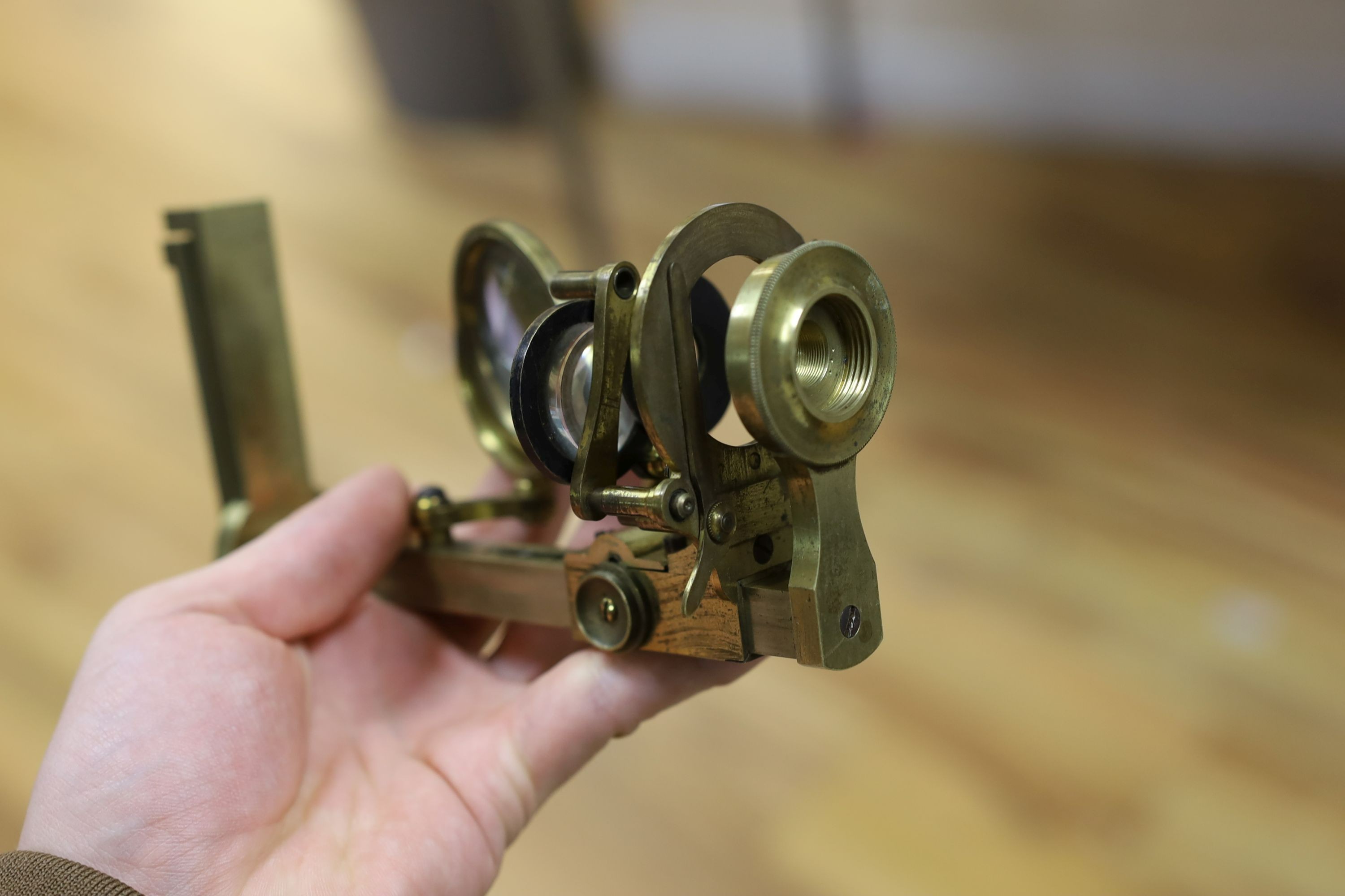 A mahogany cased microscope and a pair of Burdizzo tail dockers, 40cms long